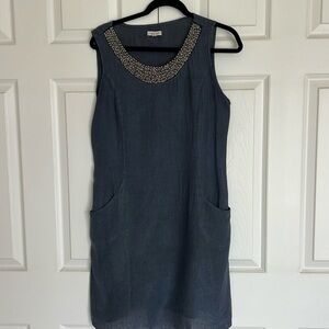 Blue sleeveless dress with beaded neckline. Length- above knee
